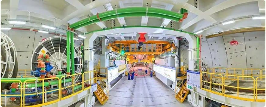 Interior of the Jianghai TBM backup gantry showing the main drive housing, control cabinets and walkways